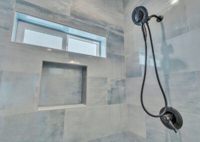Snap-ADU-Cardiff-Manchester-Ave-1-bedroom-1-bathroom-750-sqft-interior-view-primary-bathroom-tiled-shower-blue-close-up
