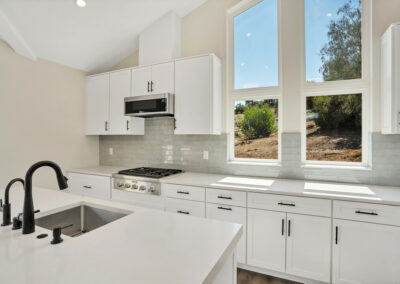 Snap ADU- Encinitas-Double LL Ranch-2BR2BA 1200 sqft-Kitchen Window View-Over Island-White Cabinets